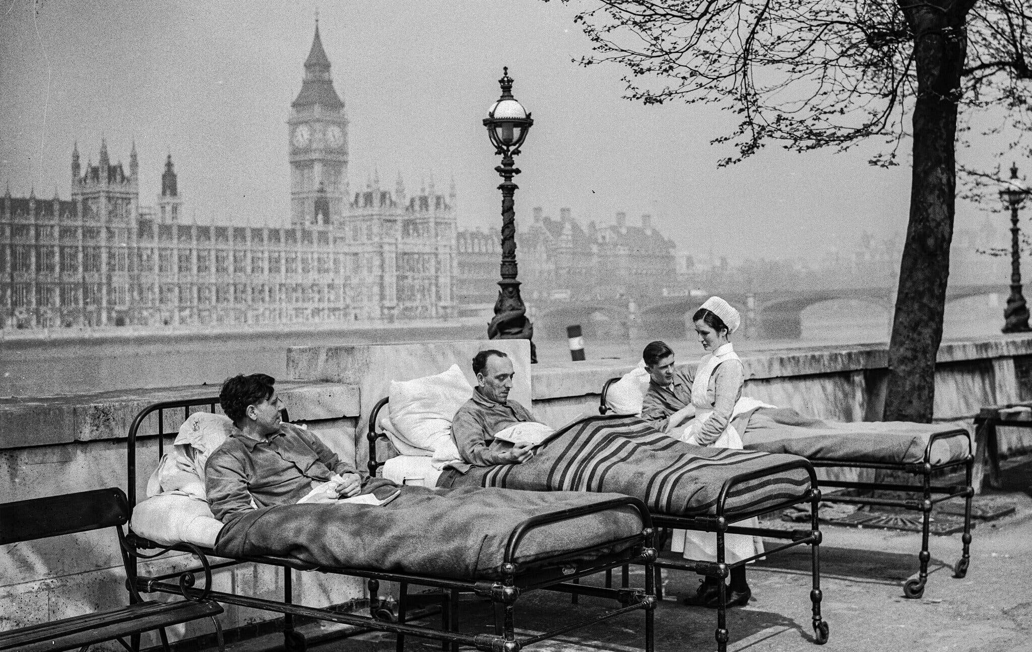 Tuberculosis patients recovering in open air along the River Thames in London in 1936.